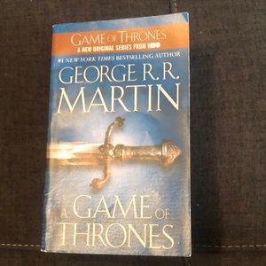 A Game of Thrones book by George R. Martin softbk